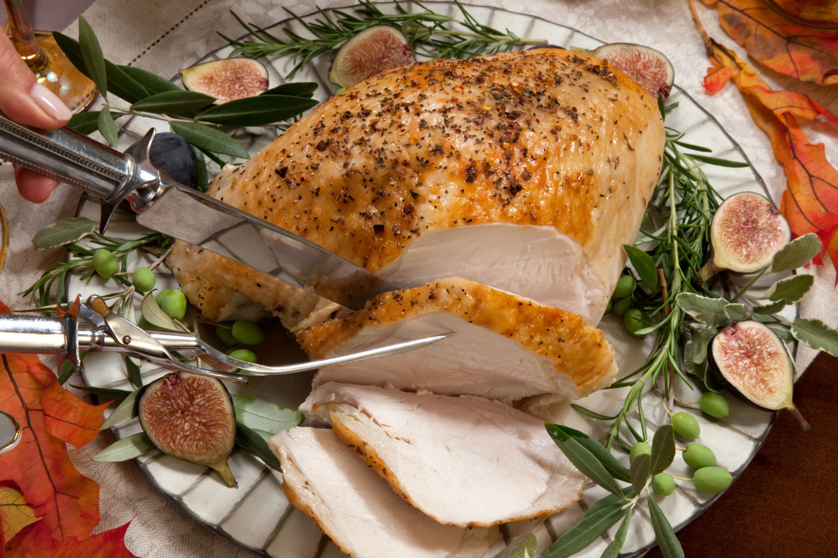 Roasted turkey breast being carved