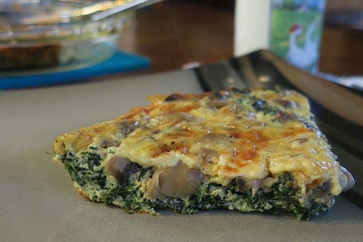 Vegetarian spinach mushroom quiche on a plate