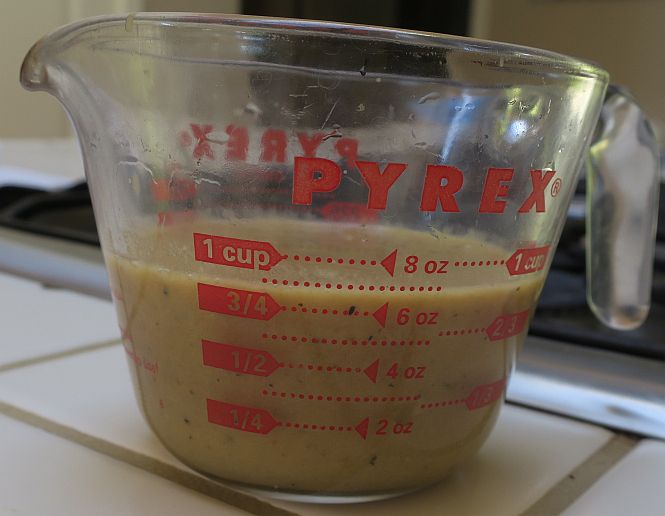 measuring cup full of mushroom gravy