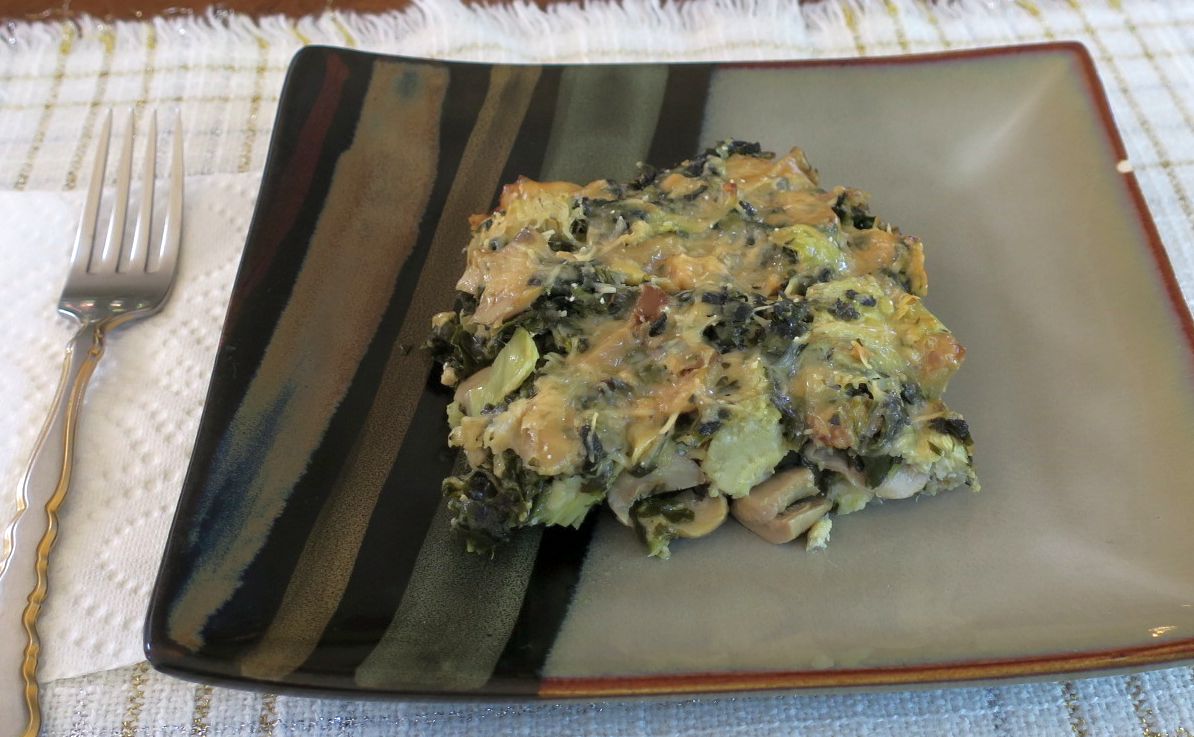 one serving of artichoke spinach mushroom bake on a plate