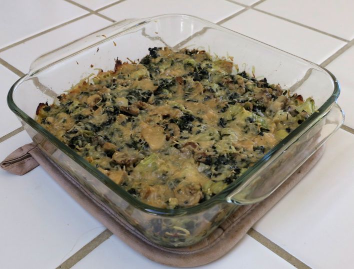artichoke spinach mushroom bake in a square glass pan