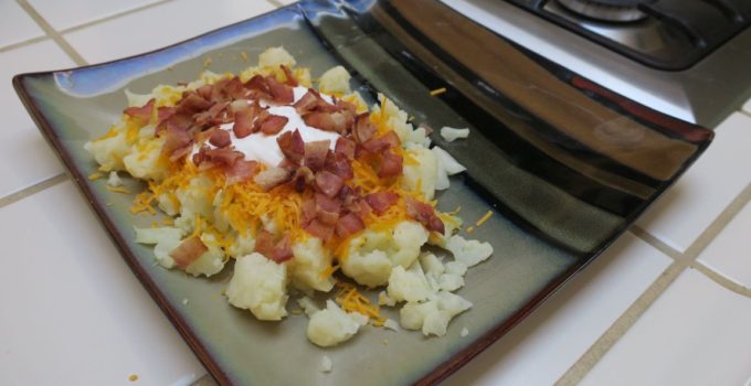 loaded cauliflower is just chopped, cooked cauliflower topped with cheese, bacon, and sour cream