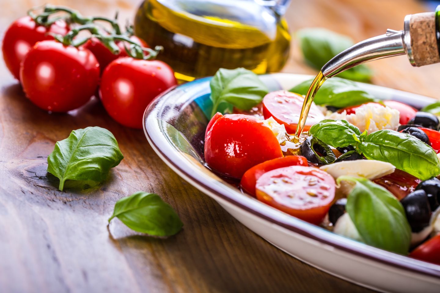 Tomato, mozzarella, basil salad with olive oil