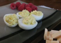 deviled eggs with smoked Gouda and raspberries