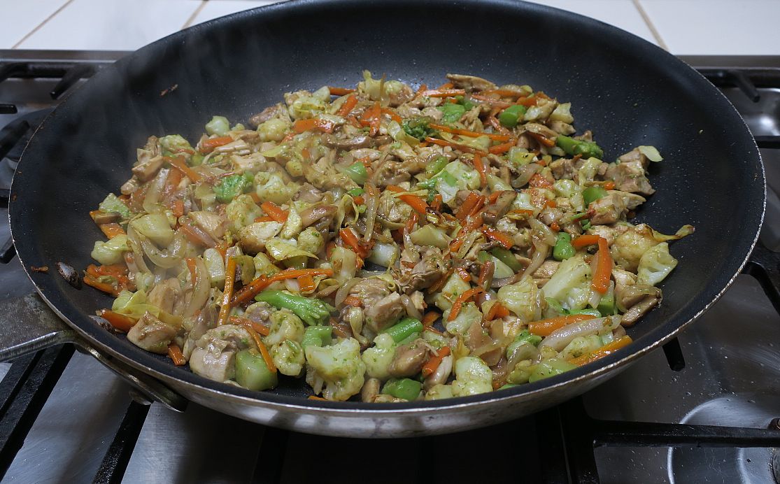 Chicken Garden Vegetable stir-fry steaming in a skillet