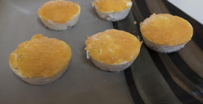 Canadian bacon egg bites sitting on plate