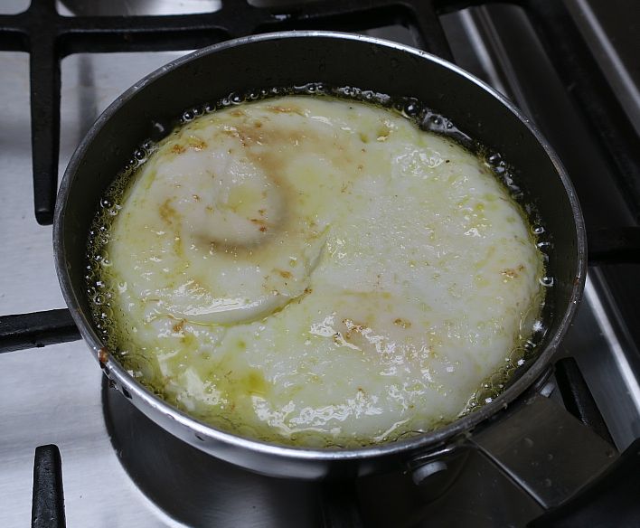 hard cooked eggs flipped over in skillet