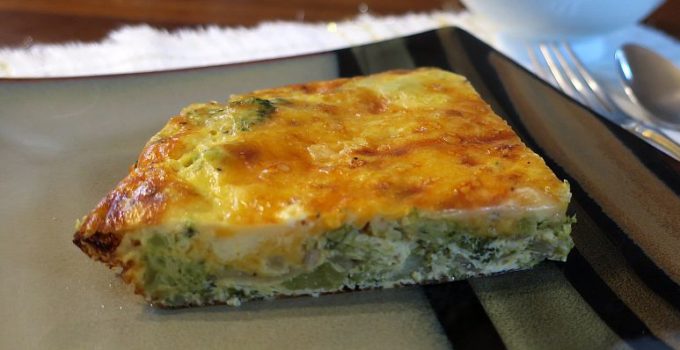 slice of broccoli onion crust-less quiche on a plate