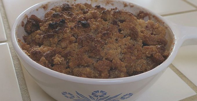 gluten-free apple crumble in a white pyrex baking dish