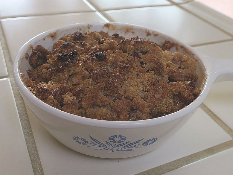 gluten-free apple crumble in a white pyrex baking dish