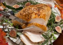 instant pot herbed turkey breast being carved on a plate